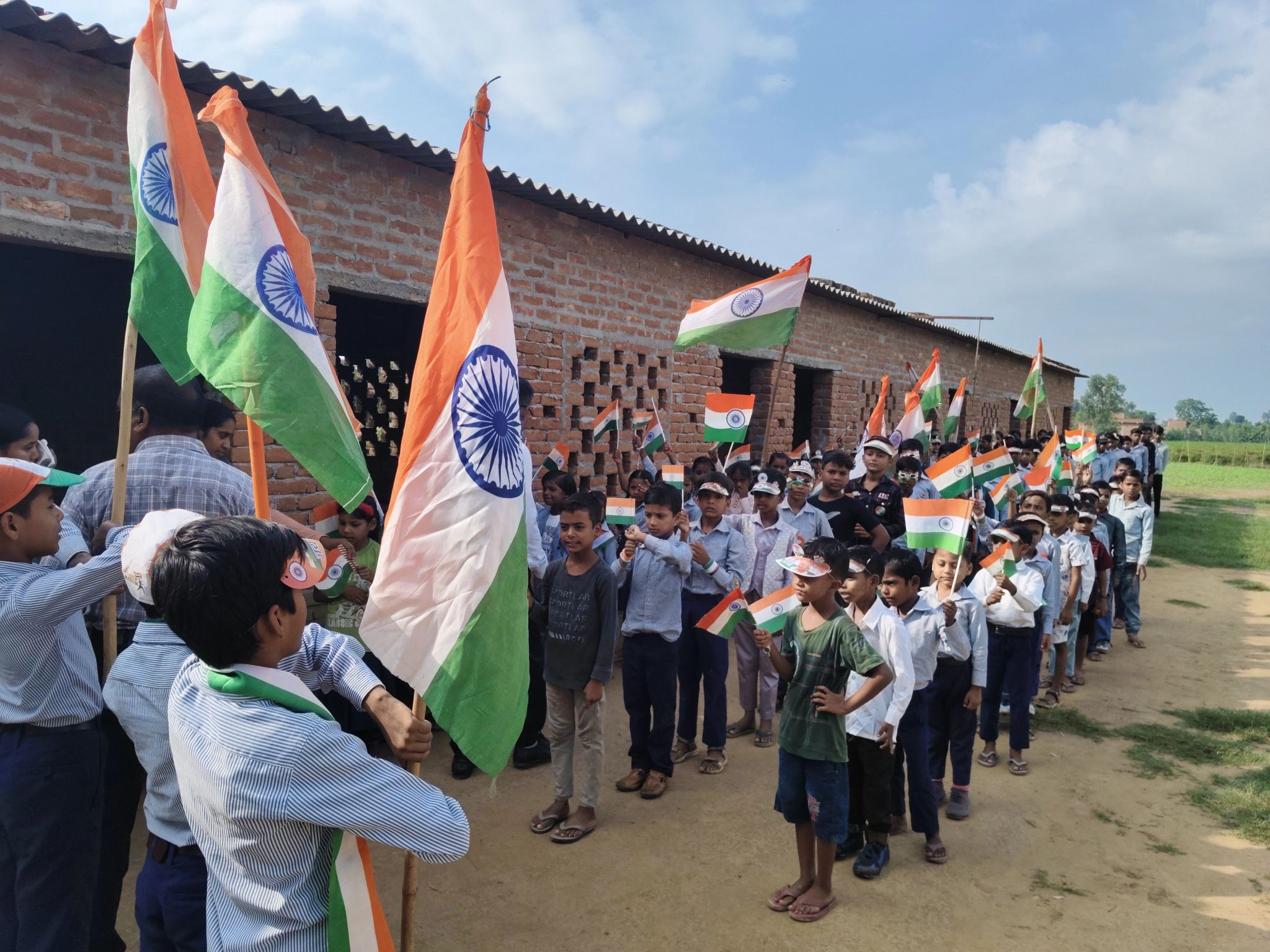 Children celebrating Independence Day with the national flag