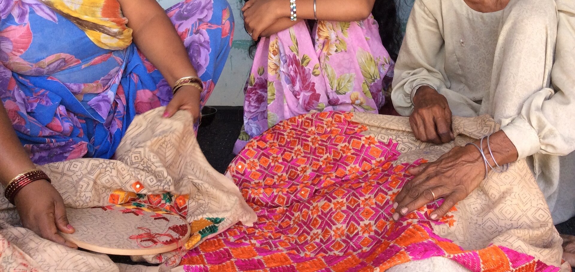 Women engaged in embroidery and craft skill work